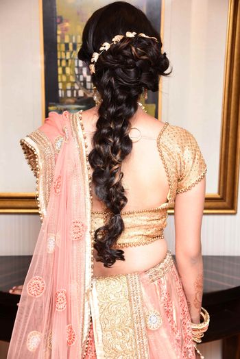 Engagement hairstyle with braid and hair accessory