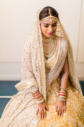 Photo of Bride in yellow lehenga