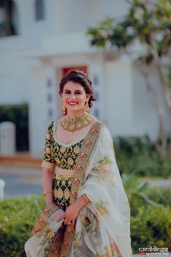 Bridal mehendi or engagement look with floral print dupatta 