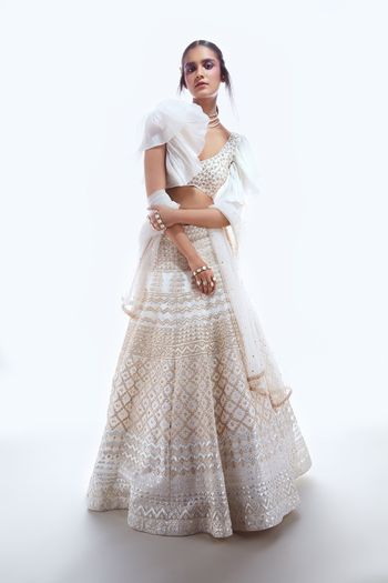 Photo of Sister of the bride lehenga in white with frill sleeves