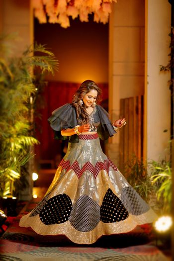 Patchwork lehenga with black and gold work and cape