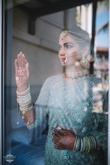 Photo of A unique bridal portrait, with a bride wearing an off-beat outfit!