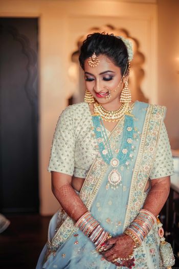 Offbeat bridal lehenga in light blue and white 