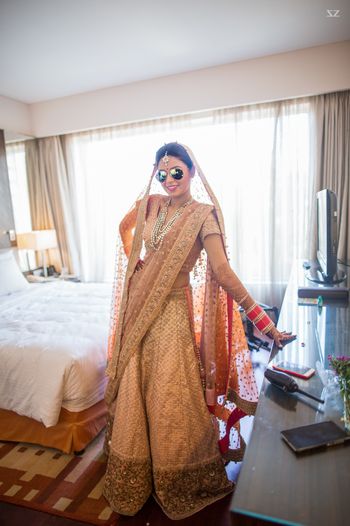 Peach and gold bridal lehenga