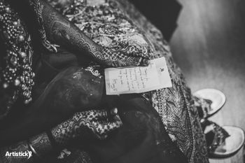 Photo of Bride reading a letter to her from the groom