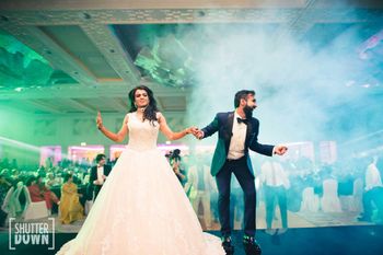 Photo of couple dancing shot on cocktail or sangeet
