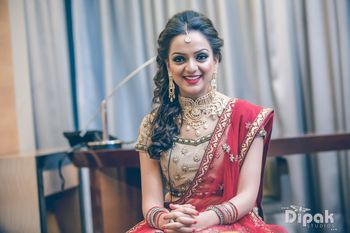 Cream and Red Lehenga Bride with Gold Choker