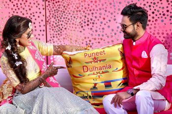 Photo of mehendi decor with colourful cushion