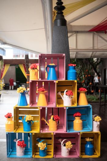 Photo of Wooden crates and jars put up together as a photobooth.