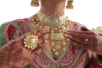 A close up shot of bride wearing contrasting jewellery