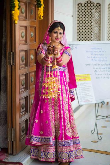 Hot Pink Lehenga with Blue Border and Gold Kaleere