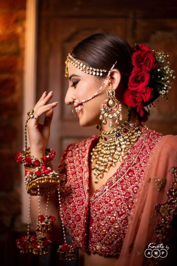 Bridal bun idea and floral kaleere in red 