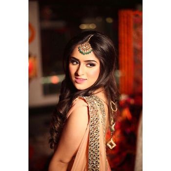 Kundan statement maangtikka with green beads