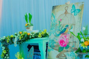 Photo of vintage aqua floral arrangement on table