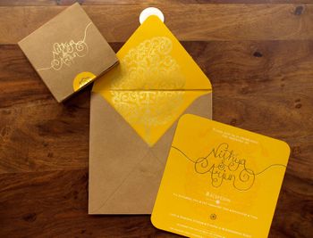 Photo of yellow and brown invitation cards