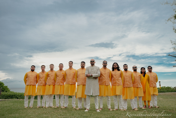 Photo of Groom posing with the groomsmen