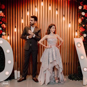 Photo of sangeet photobooth decor idea with couple posing