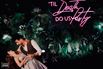 Photo of quirky sangeet stage decor idea with couple dancing