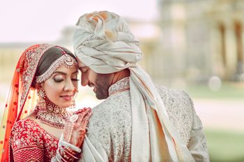 romantic couple shot with the groom in a unique safa 