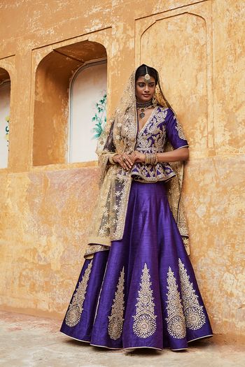 Photo of Purple Bridal Lehenga with Silver Motifs