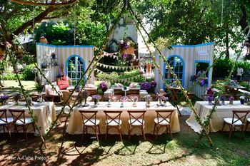 Outdoor table settings with teepee tents.