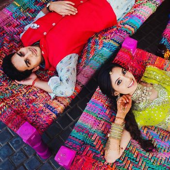 Couple lying on cots and posing.