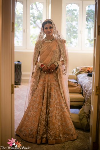 Bridal lehenga in peach and silver