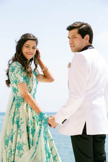 Photo of White gown with blue bead work for engagment