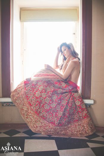 red raw silk bridal lehenga with all over motif