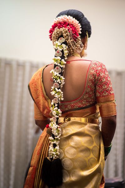 Photo of South Indian bride with floral Jada