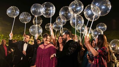 Victorian Elegance Under a Sky of Balloons