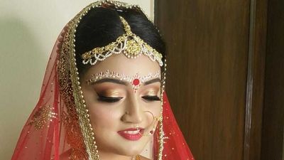 Doesn't she look like a regal Beauty of Bengal?Bridal makeup by "Tanya Puri".