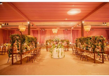 long table seating idea for wedding indoors and floral decor