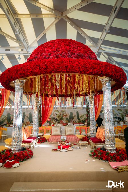 Red floral mandap with metallic silver