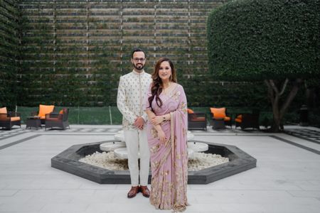 Perched against a gorgeous floral backdrop, my stunning bride Ritika rocked  our best-seller Pink Lehenga, pairing it with diamonds - a fo... | Instagram