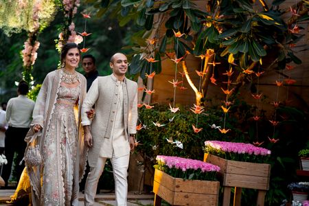 Photo of Matching bride and groom on mehendi in grey outfits