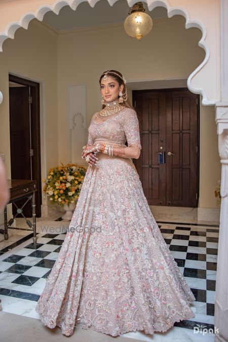 Heavy bridal lehenga in light pink and grey hues with gorgeous jadau and polki bridal jewellery