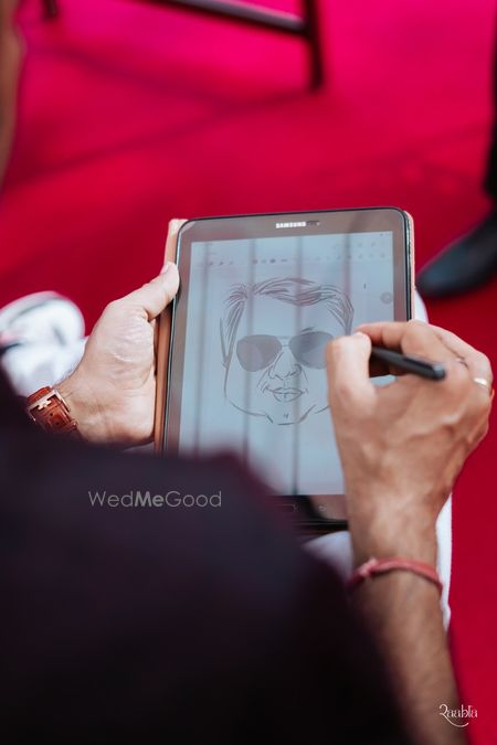 Photo of Fun digital caricature artists for guests for carnival themed mehendi