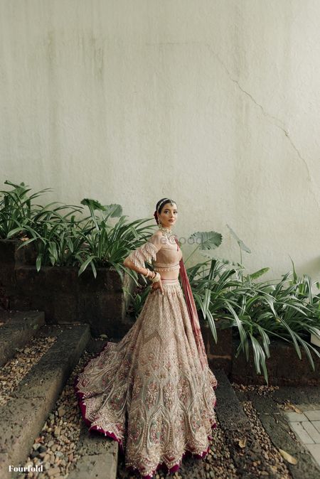 Gorgeous Tarun tahiliani lehenga with a statement blouse with tassels