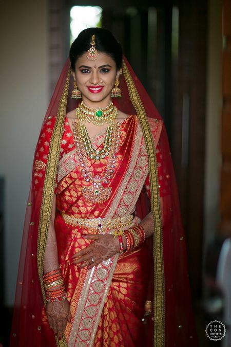 South Indian bridal look in red saree with dupatta 