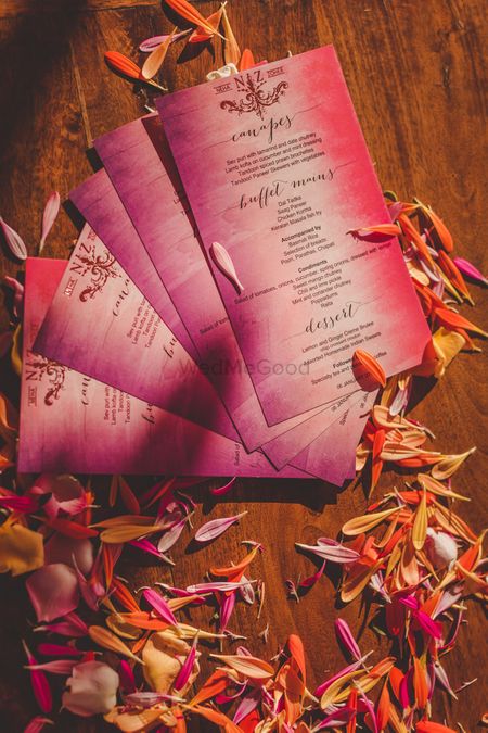 Photo of Ombre purple menu cards at wedding