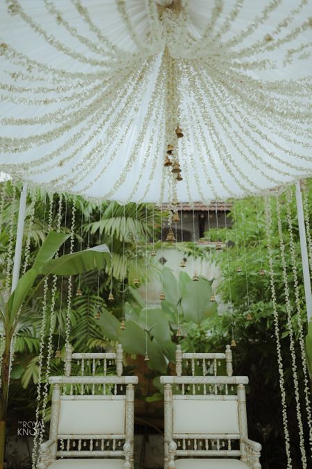 Photo of simple elegant mandap idea for home wedding with mogra strings