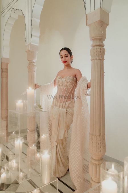 Stunning bridal shot in a beige and gold strapless gown with sheer details