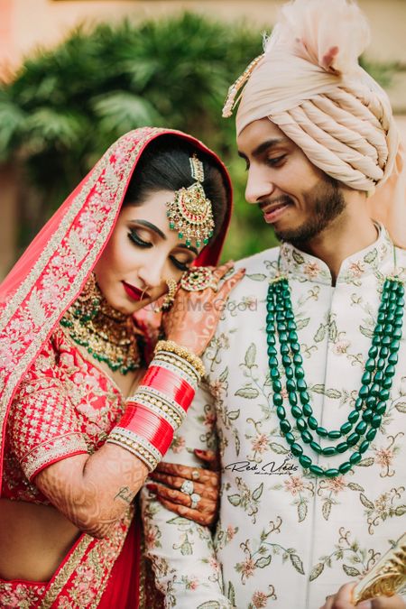 Photo of couple pose idea with groom in contrasting jewellery