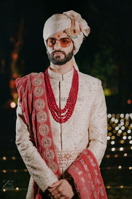 punjabi groom look with red and cream accents