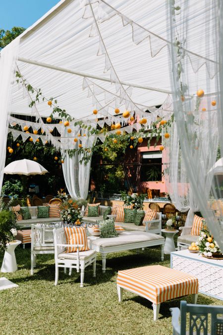 Photo of Beautiful lemon and orange inspired decor in orange and white theme for an outdoor event