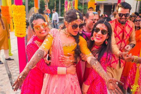 Photo of Bride with Bridesmaids on Mehendi with Sunglasses