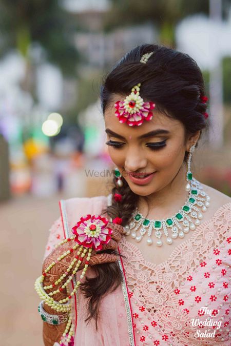 Floral jewellery look for bride on mehendi 