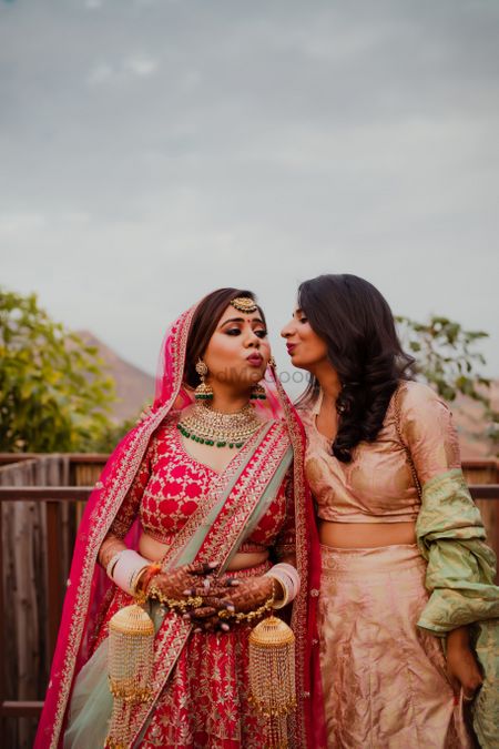 Photo of bride and sister pouting shot