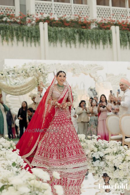 Gorgeous red and gold lehenga with a gold blouse for the bridal look on the wedding day